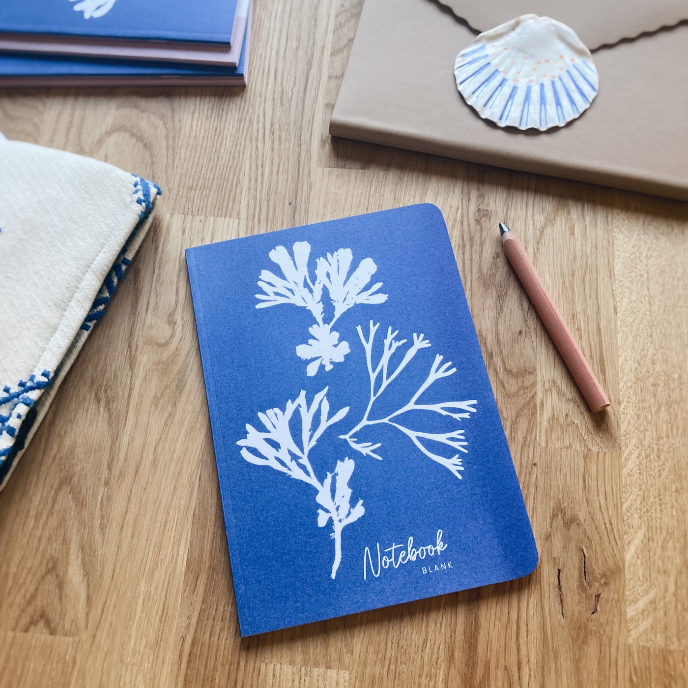 Our Seaweed trio coastal notebook features a cyanotype impression of seaweed pieces on the cover. Designed in our Cornwall studio from an original cyanotype image.&nbsp;