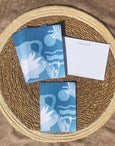 Sunshine and Plants postcard set of 10, featuring layered hand cut elements of waves, plants and a mediterranean style