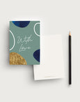 Postcard writing set with a green coloured background and the words 'With Love' in a handwritten font