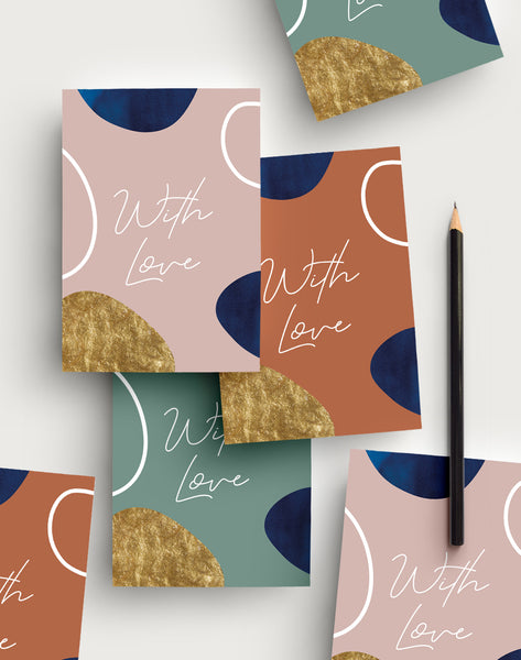 Abstract postcard writing set with 3 different coloured backgrounds and the words 'With Love' in a handwritten font