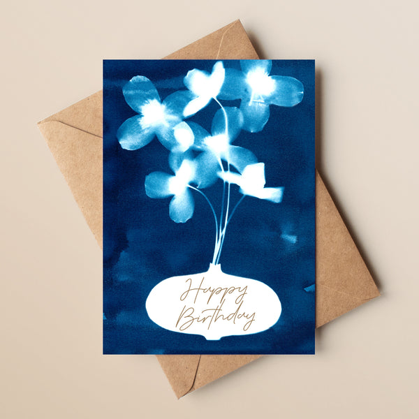A beautiful Happy Birthday card, featuring pressed flowers within a vase, produced from an original cyanotype exposure. Each card comes complete with quality kraft envelopes and are left blank inside.