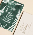 Paper Birch Fern Wedding Invitations featuring pressed ferns exposed in sunlight using the cyanotype technique. A natural soft green in colour, A6 in size and left blank for you to fill in your special day details.